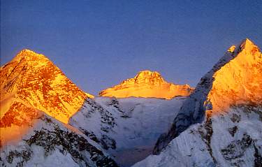 Everest Book - Climbing the World's 14 Highest Mountains: The History Of The 8000-Meter Peaks - Everest, Lhotse and Nuptse at sunset